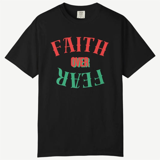 A black short-sleeve crewneck t-shirt featuring a graphic text design on the front that reads 'FAITH OVER FEAR' in red and green stylized lettering, displayed against a light gray background.