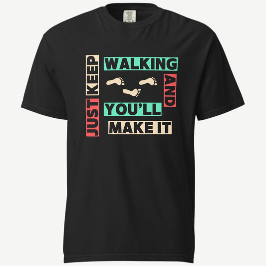 A black short-sleeve crewneck t-shirt with a colorful graphic print on the front. The graphic features the words 'JUST KEEP WALKING AND YOU'LL MAKE IT' in beige, teal, and red block letters, interspersed with small beige footprints.